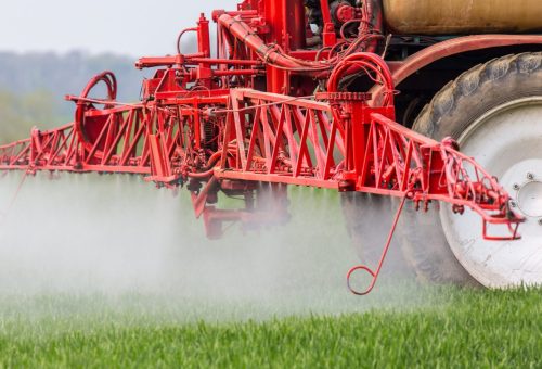 Spraying machine working on the green field